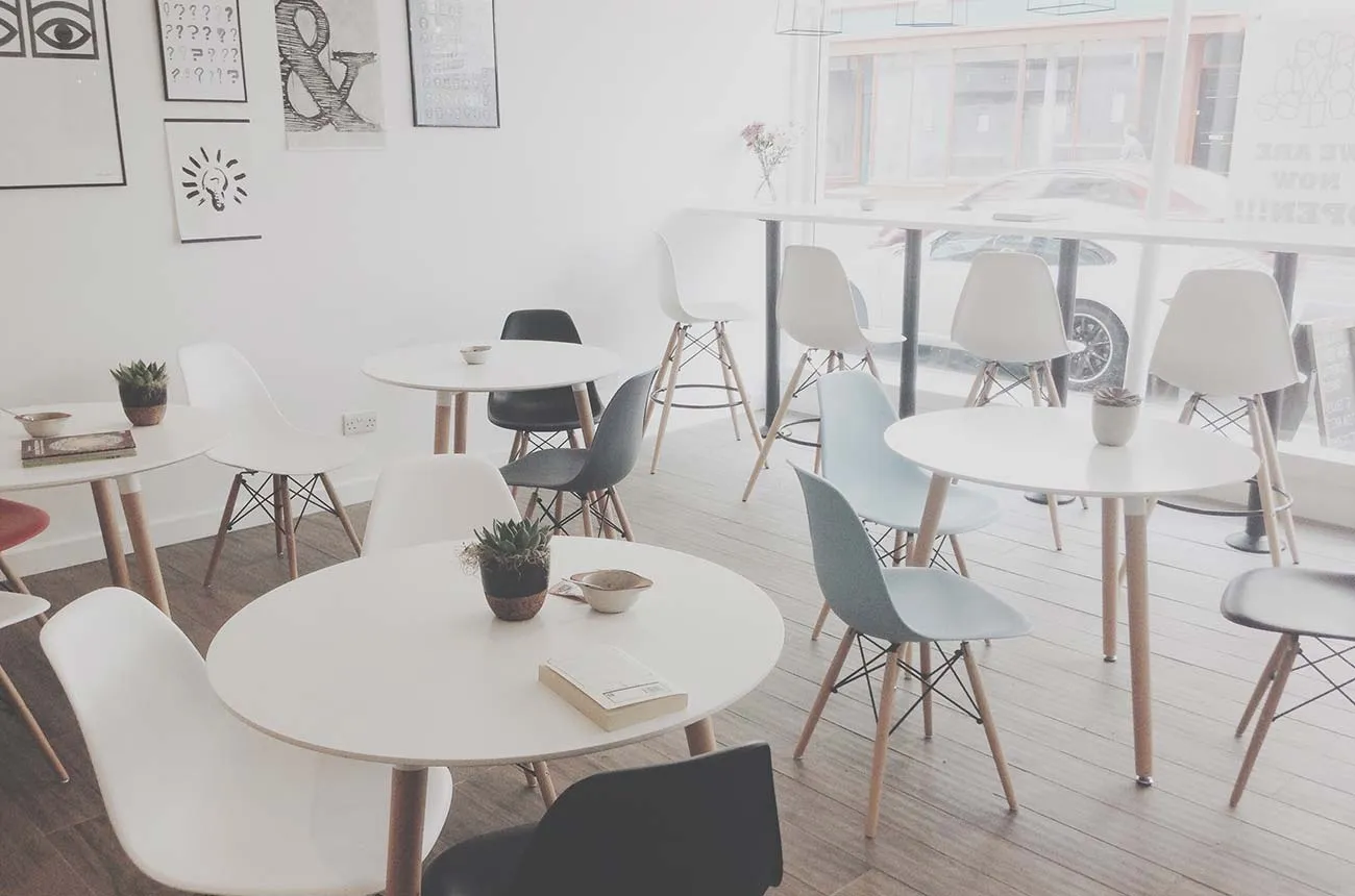 Tables and chairs in a bright cafe