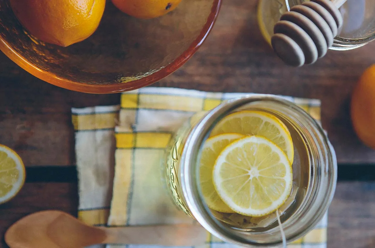 Sliced lemon and cooking ingredients viewed from above